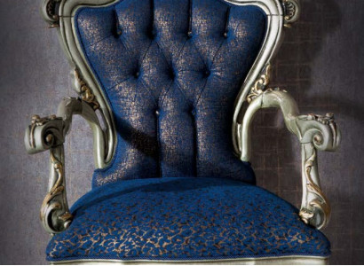 A fabulous armchair in classic style in blue with decorative patterns